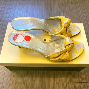 Beautiful yellow and silver sandals. Never worn. 2-1/4 inch heel.